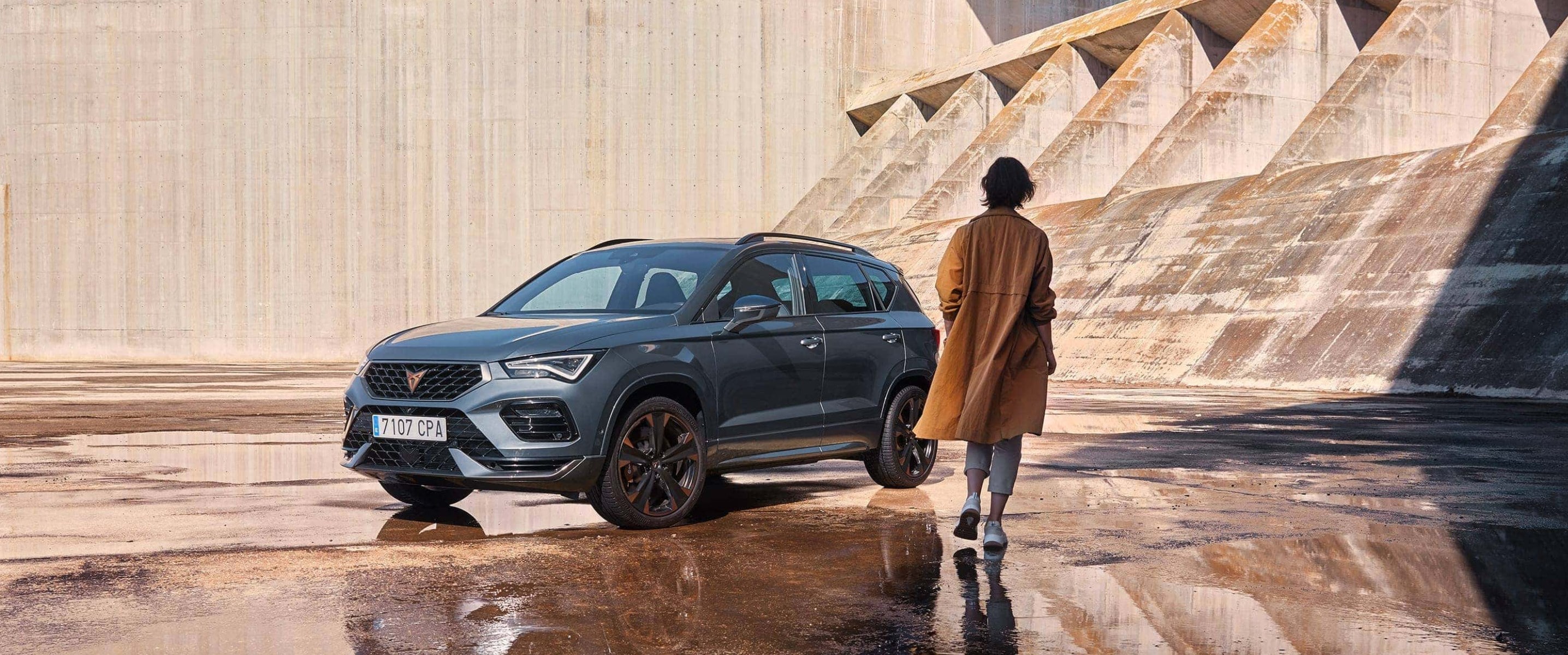 Woman standing beside CUPRA Ateca