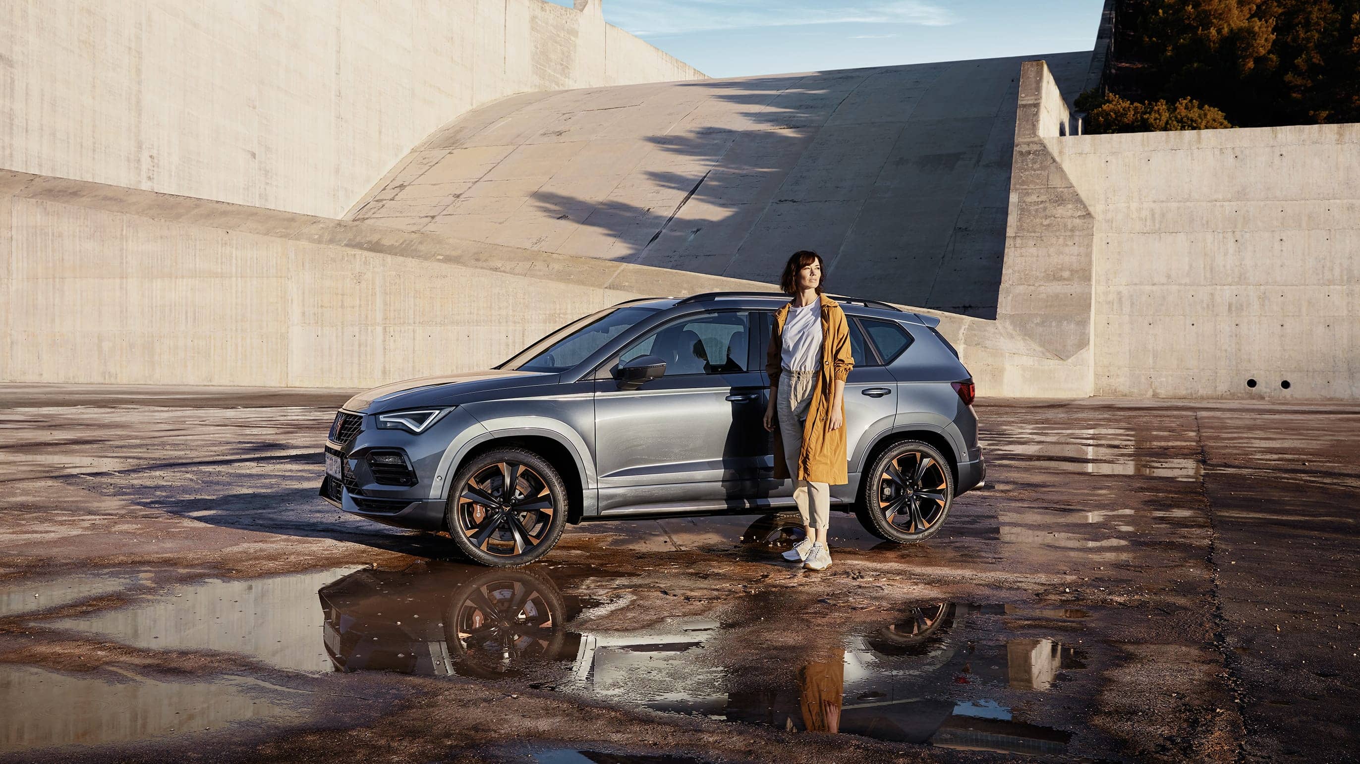 Woman standing beside new CUPRA Ateca