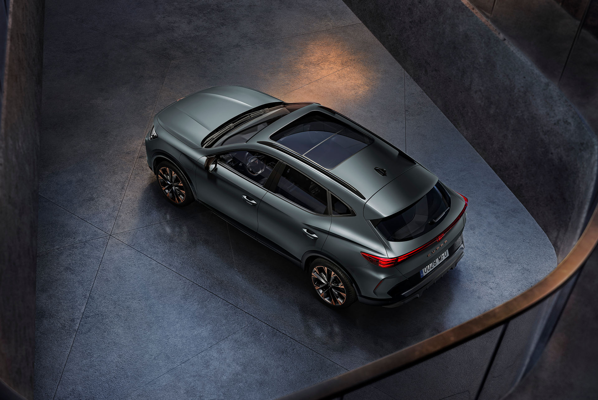 CUPRA Formentor showcasing its sleek and design, set against a night skyline at its back.