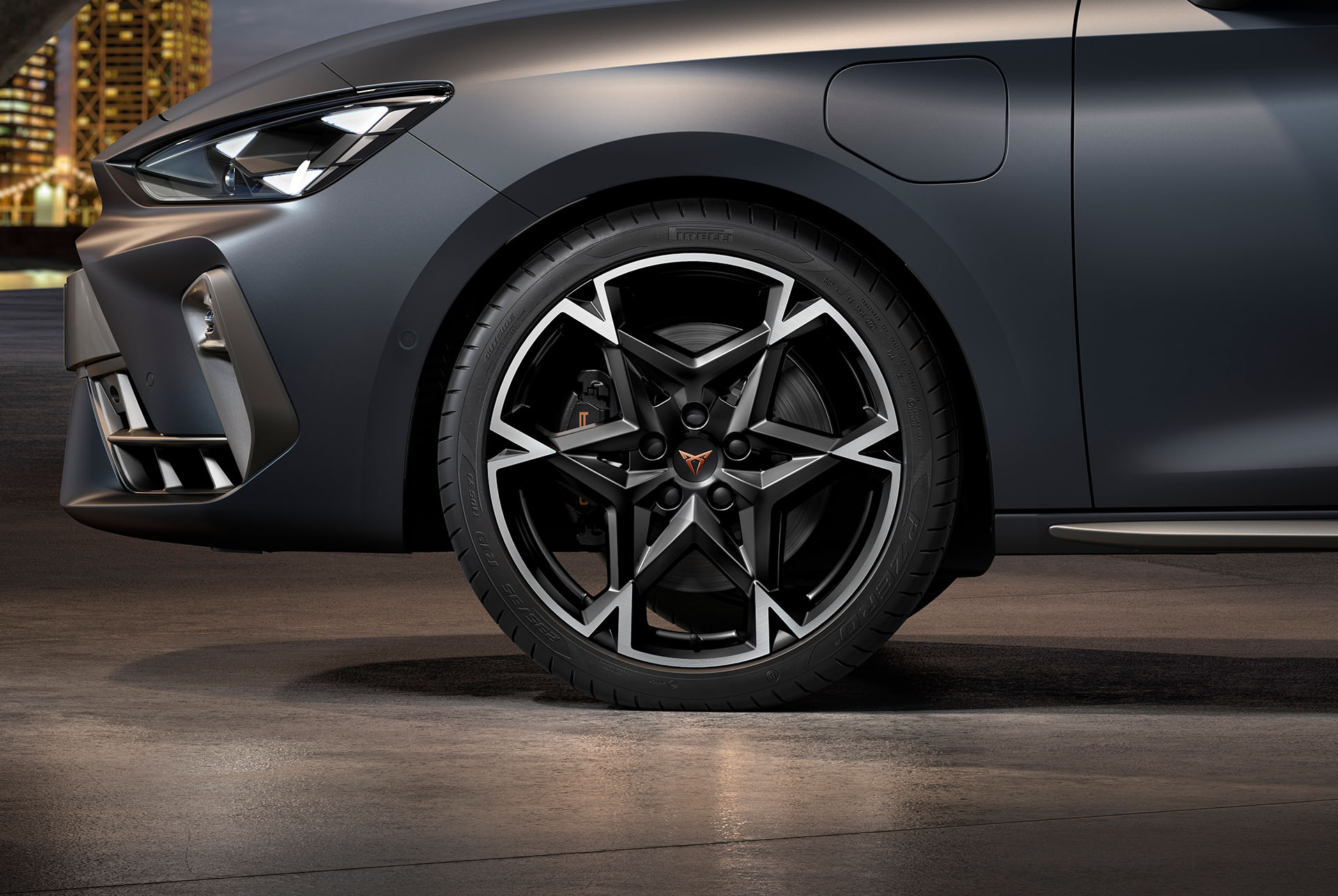front side view of left machined polar alloy wheel in black and silver for the new cupra leon spotstourer 2025, tyres, signature headlights and grey body