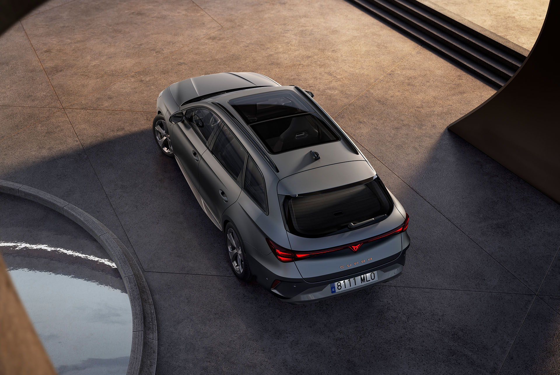 CUPRA Leon SP featuring the dark pack. The image showcases the CUPRA Leon SP enhanced with the dark pack, including sleek dark aluminium side skirts, a glossy black roof spoiler for an elegant sporty touch, and dark shadow garbi alloy wheels, completing its refined and dynamic design.