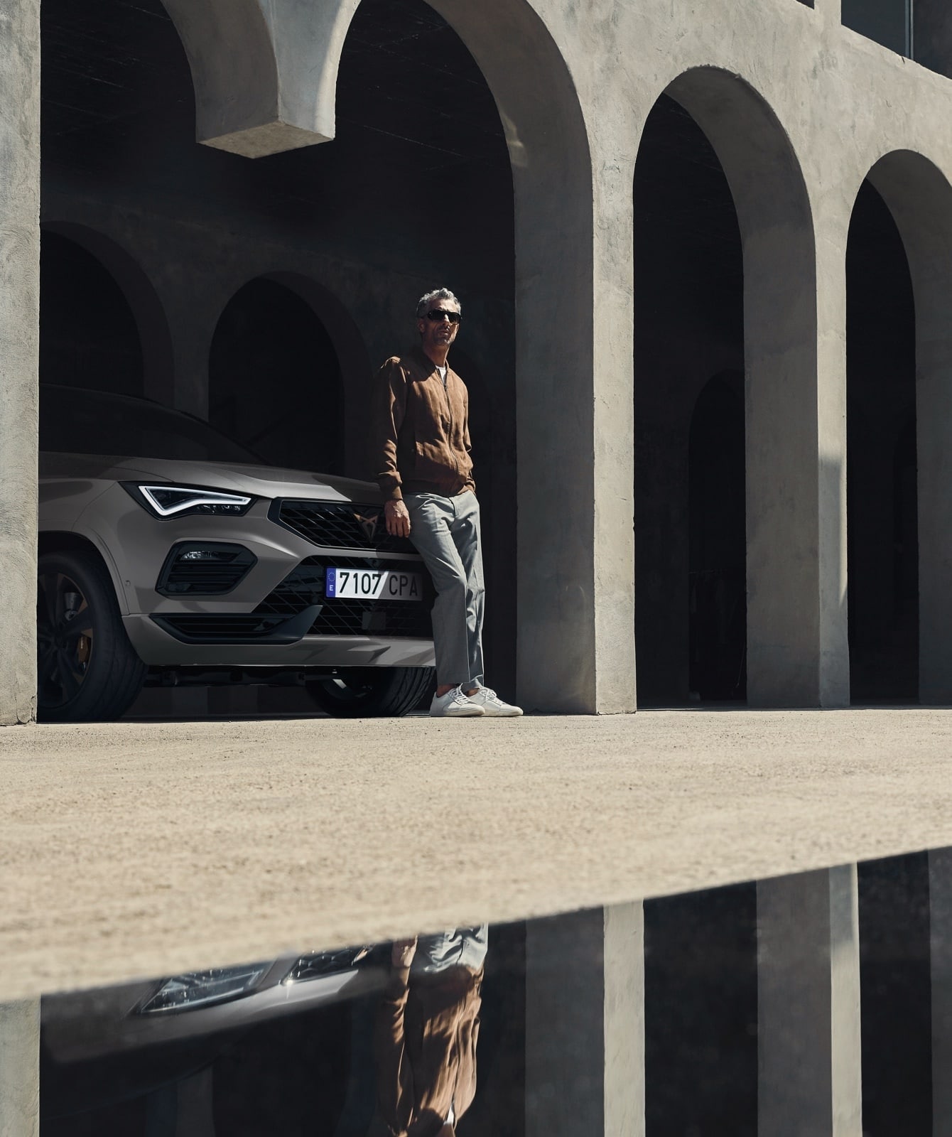 Man leaning on CUPRA Formentor front grill